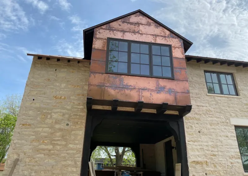 Copper metal panel facade on a stone building for Metal Roof Coating in Pasadena