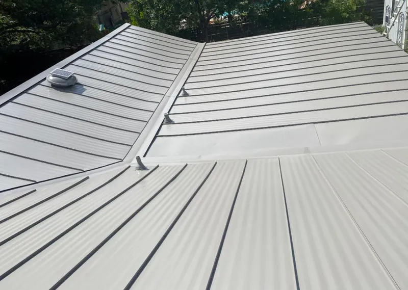 Solar attic fan installed on a metal roof for Roof Ventilation in Pasadena